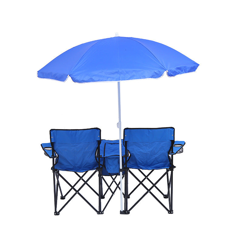 Two blue folding camping chairs with a matching blue umbrella on a white background