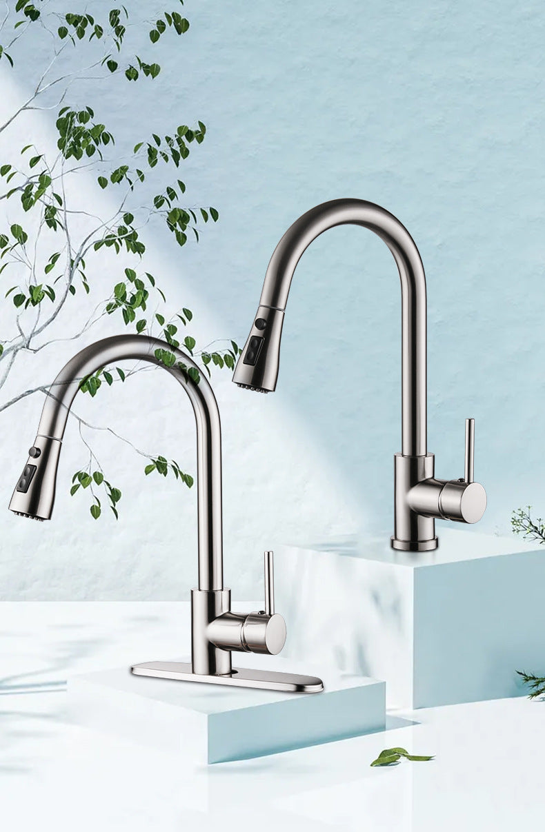 Modern kitchen faucet with a light blue background and green leaves.